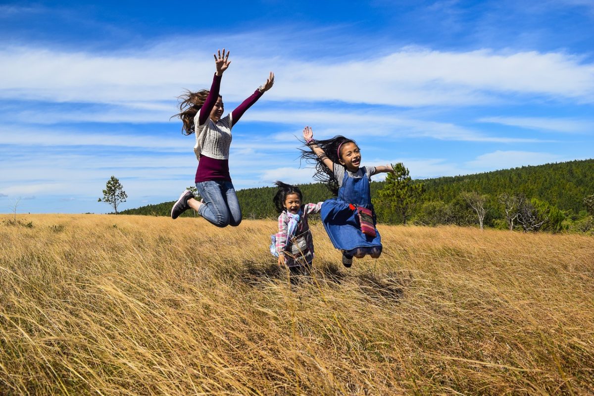 happy-enjoying-three-young-girls-in-field